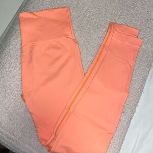 Neon orange leggings.